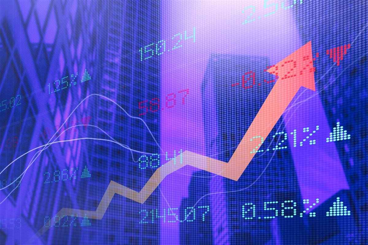 Composite image of uptrending stock chart and skyscrapers.