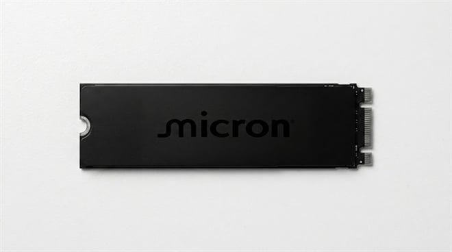 A black Micron M.2 SSD on a plain background.