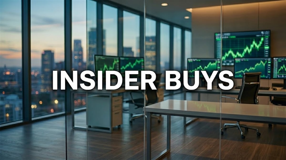 Text reading "Insider Buys" overlaid on a financial trading office with stock charts on monitors.