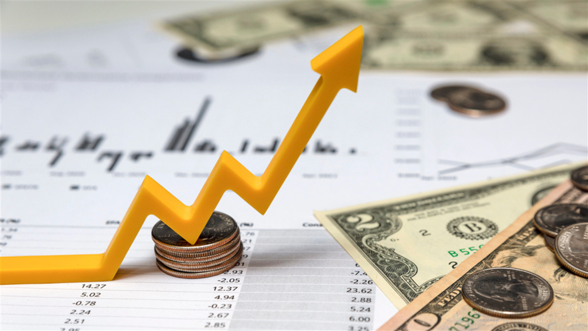 Upward arrow stock market on stack of coins