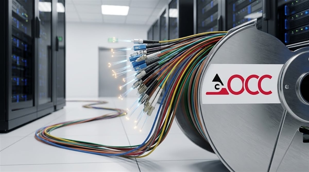 OCC-branded spool of fiber optic cables with illuminated connectors inside a data center.