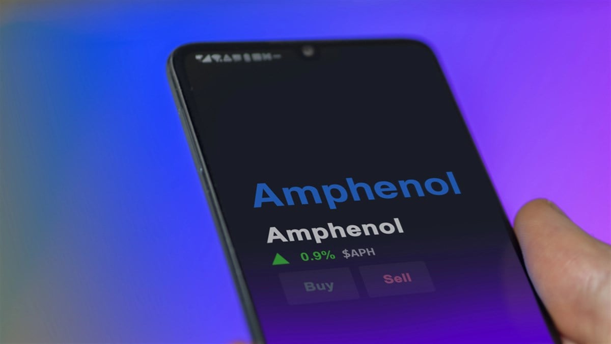 The logo of Amphenol on the screen of an exchange. Amphenol price stocks, $APH on a device