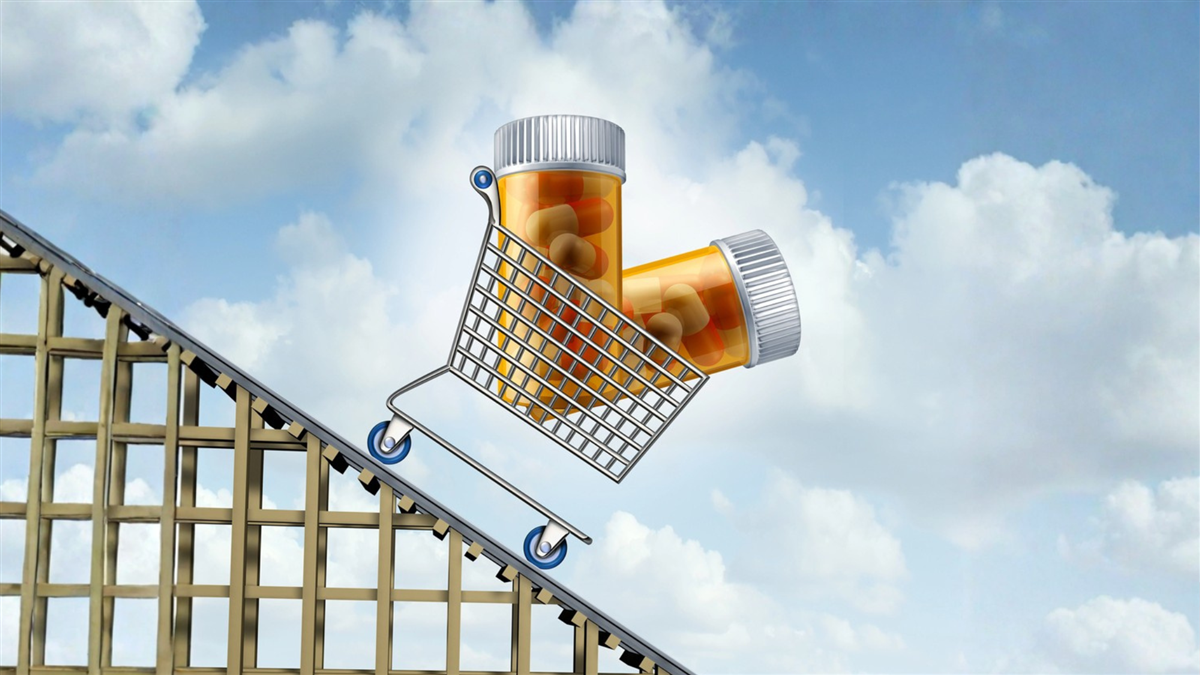 A grocery cart with two bottles of pharmaceuticals is heading down a steep down ramp