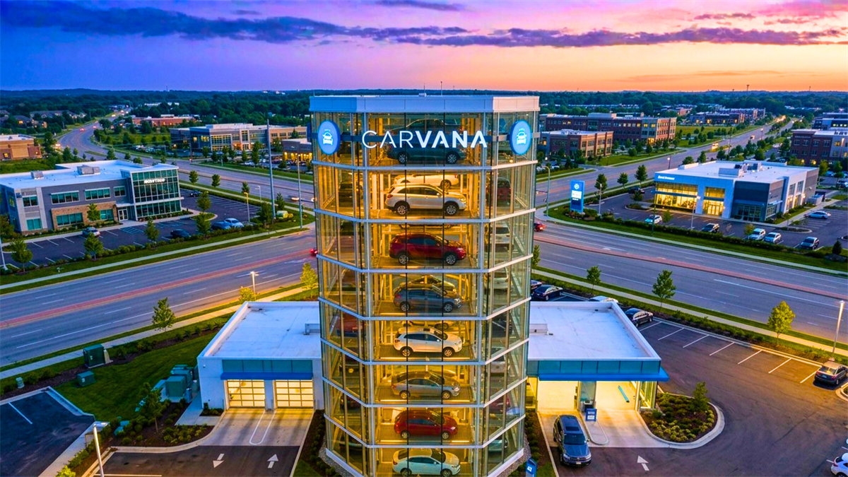 Carvana car vending machine tower at dusk.