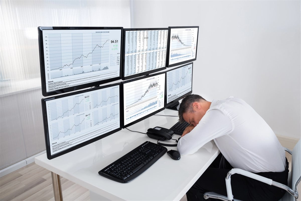 Photo of a sleeping stock trader, boring stocks.