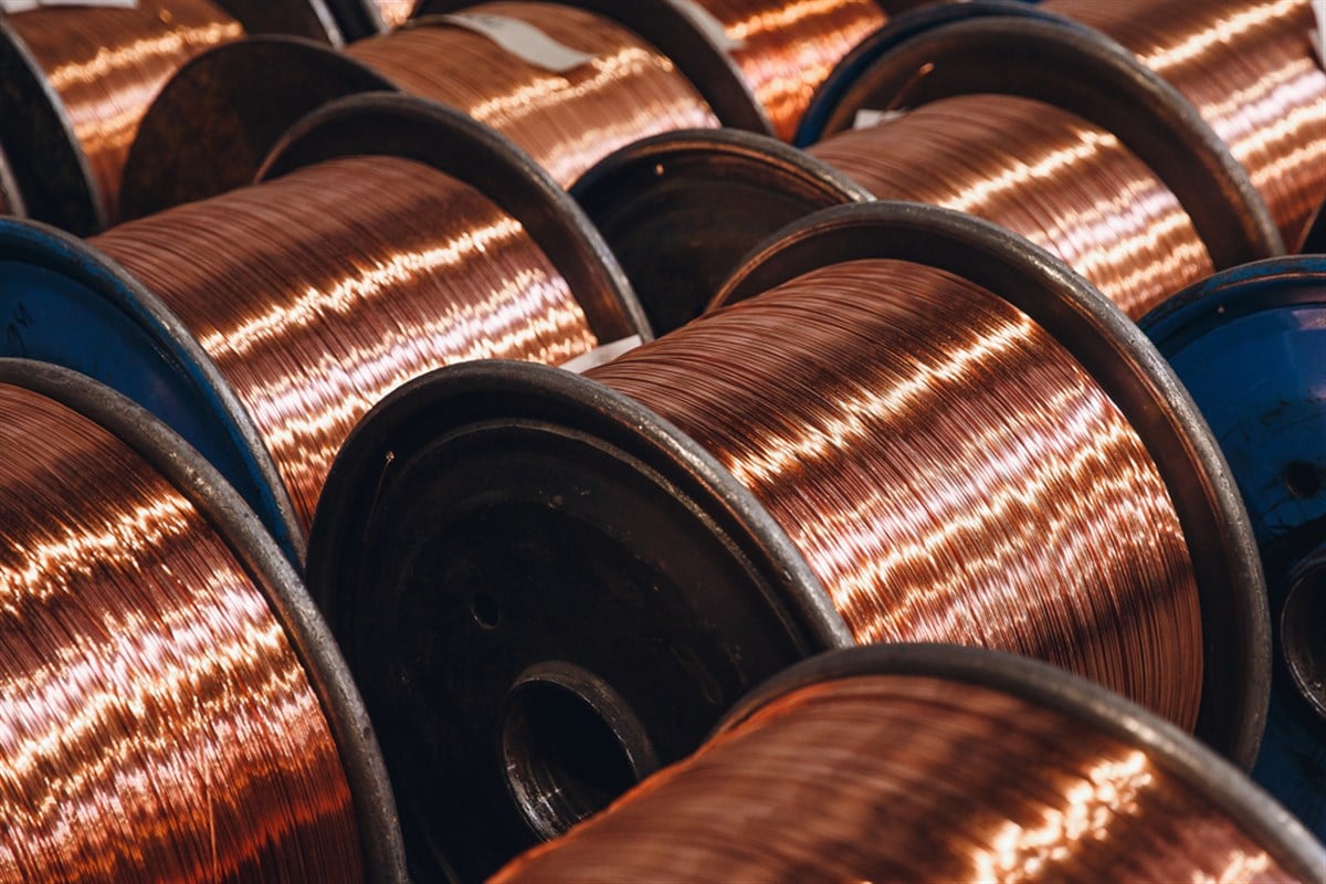 Production of copper wire, bronze cable in reels at factory - stock image