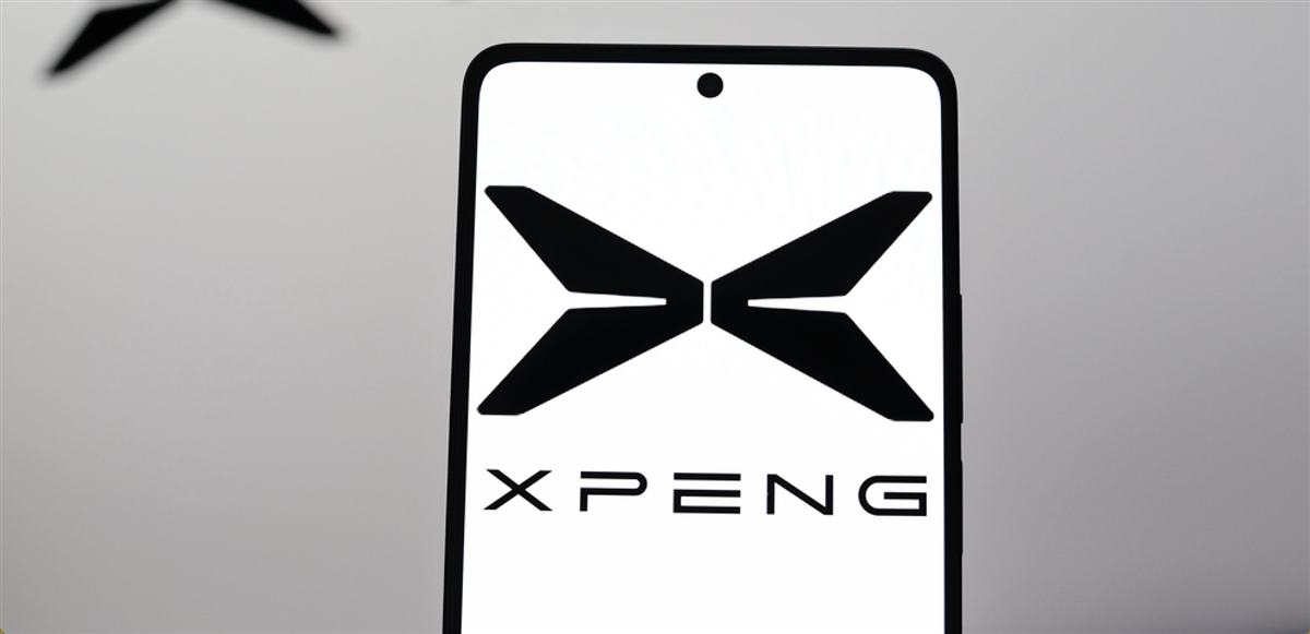 August 26, 2024, Paraguay. In this photo illustration, the XPeng Inc. logo is displayed on a smartphone and in the background