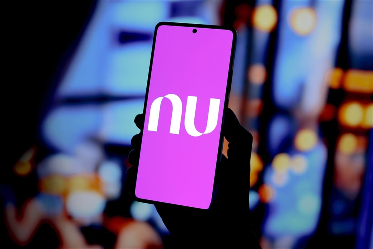 Nu Holdings logo is displayed on a smartphone screen.