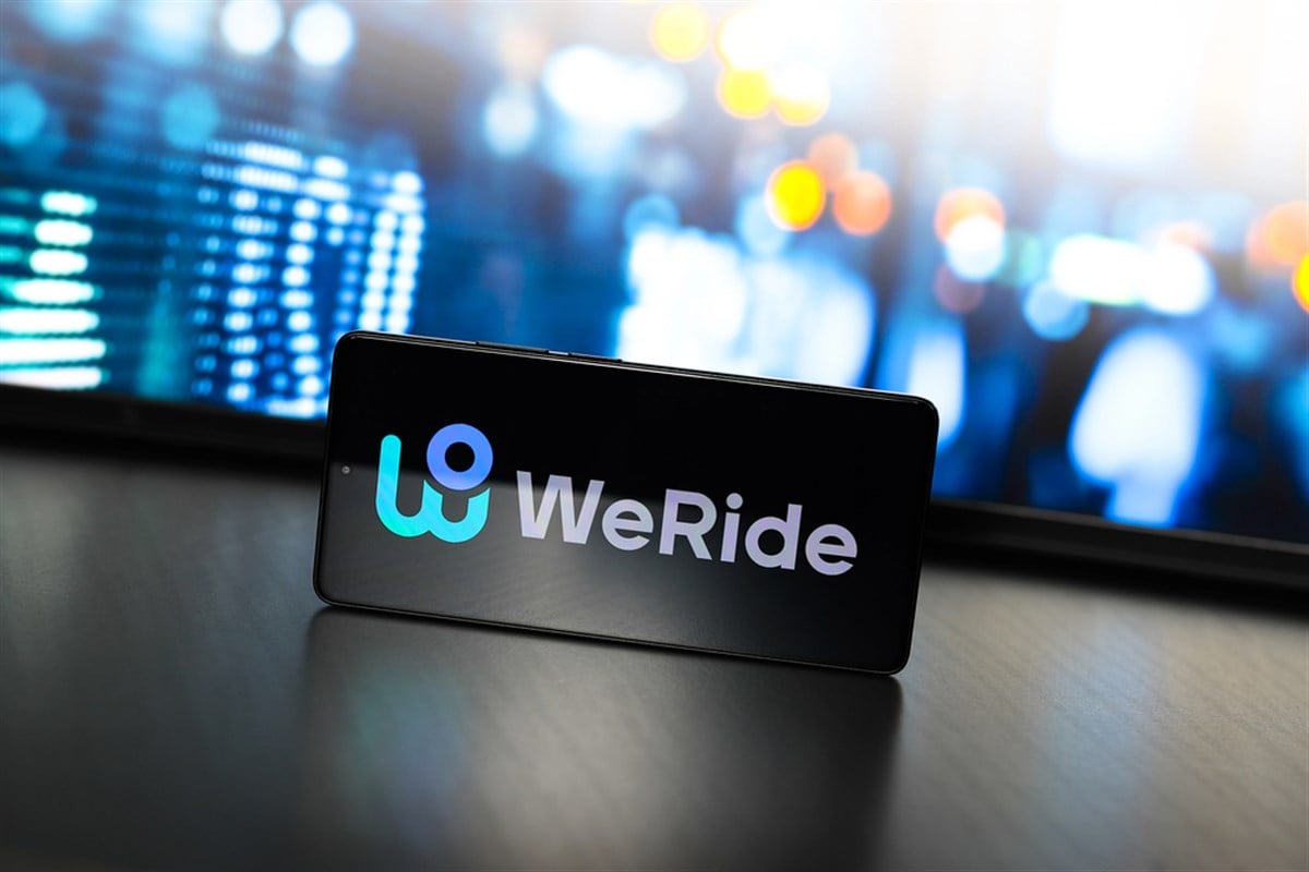 WeRide company logo on smartphone.