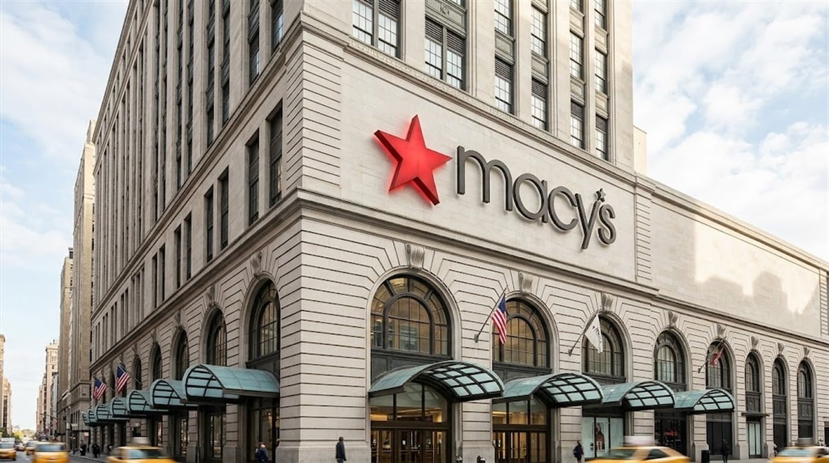 Exterior of Macy's flagship department store in New York City, with taxis passing on the street.