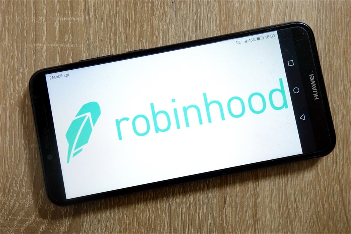 Robinhood logo on a smartphone screen, sitting on a table