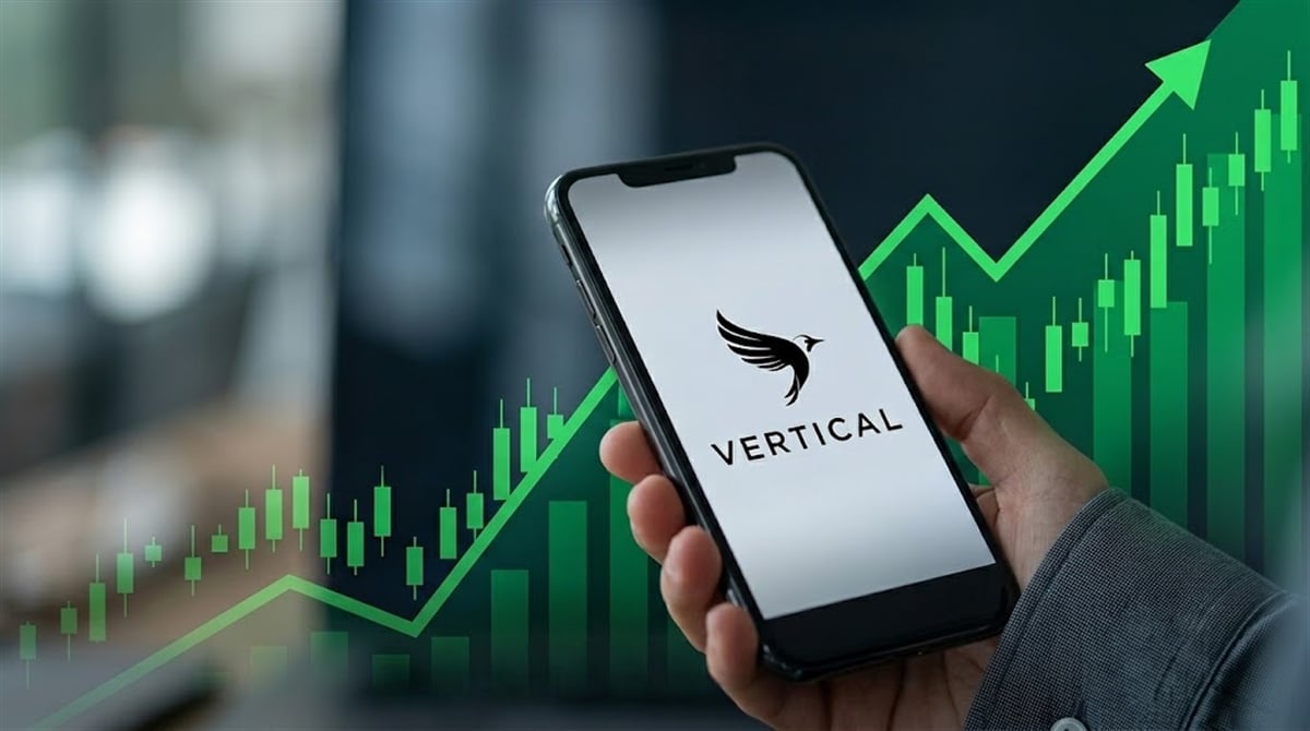 A hand holds a smartphone displaying the Vertical logo against a green upward-trending candlestick chart background.