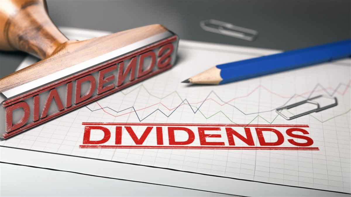 Rubber stamp with the word dividend printed over a stock chart. Concept of investment. 3d illustration.