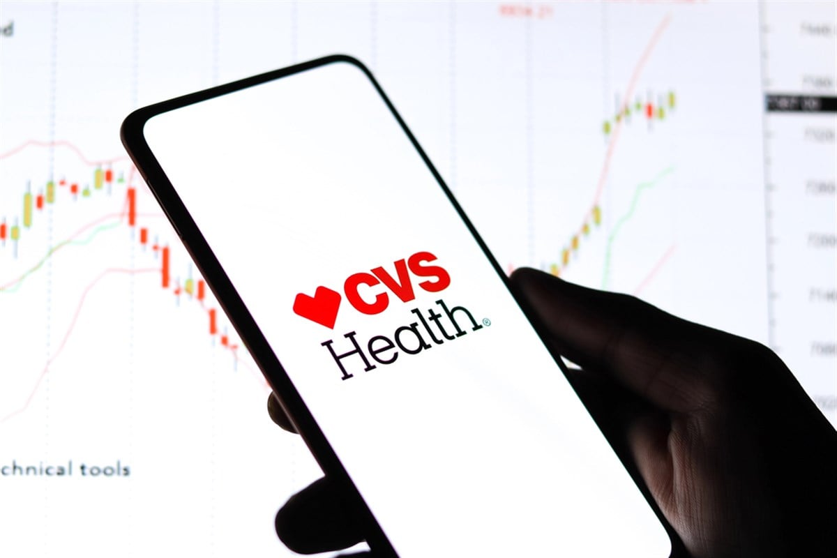 CVS logo on cellphone with stock chart 