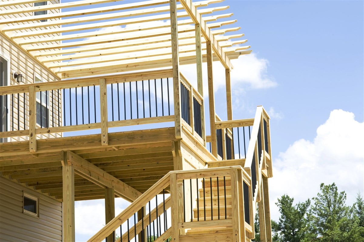 Wood construction of porch in progress.