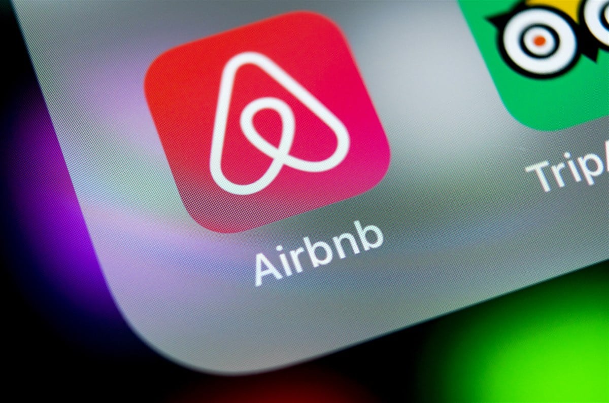 Airbnb application icon on Apple iPhone X screen close-up. Airbnb app icon.