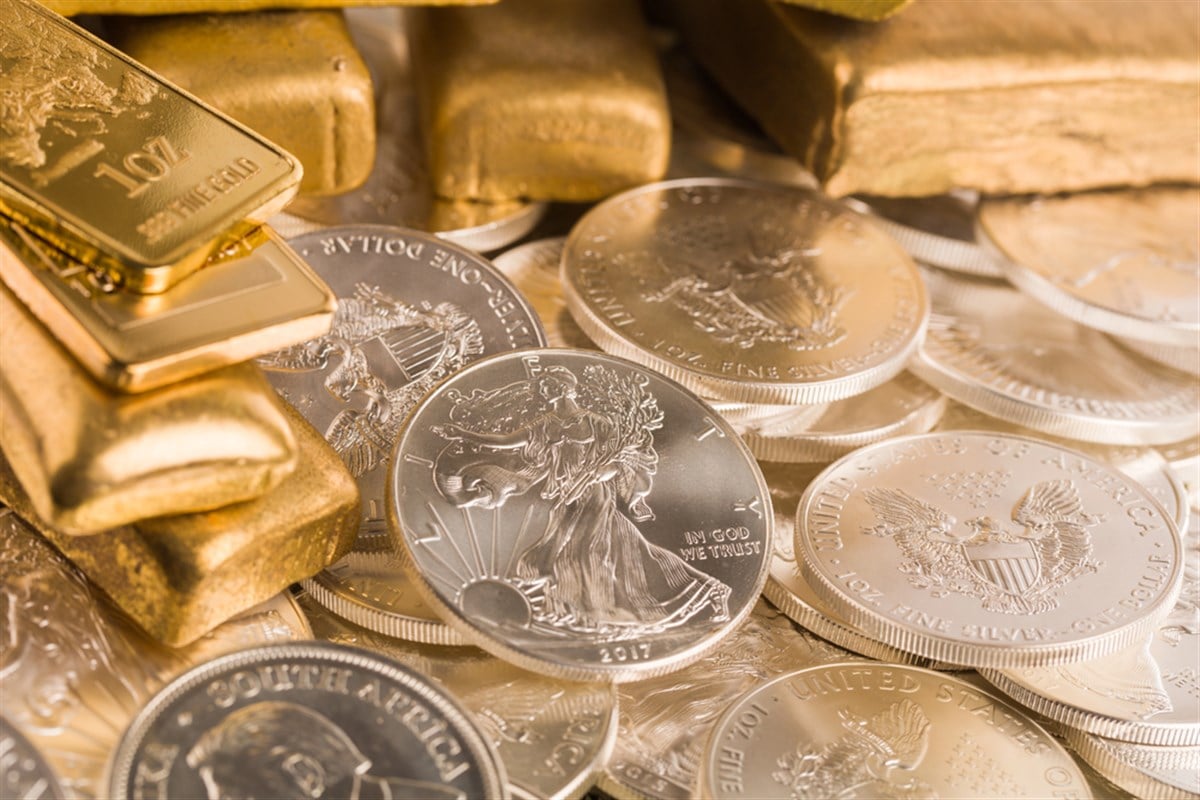 Silver and gold bullion on the table