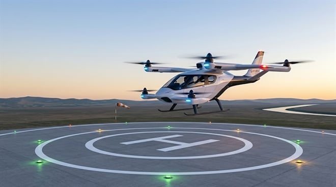 An eVTOL aircraft hovers above a lit helipad at dusk.