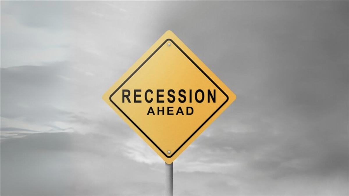 Recession sign with sky background