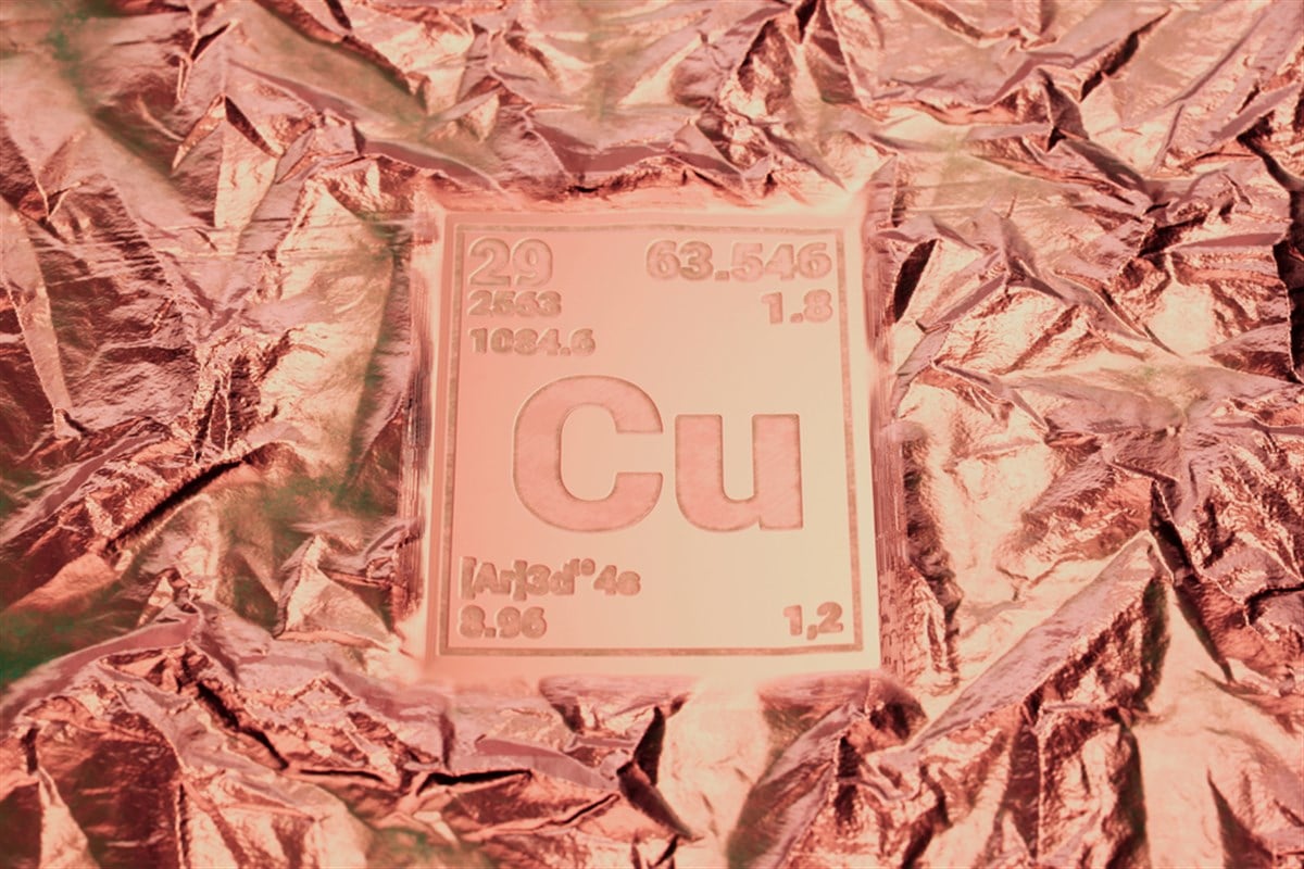 A visual representation of the copper element from the periodic table, showcased on a textured metallic foil, emphasizing its significance in chemistry and industrial applications. — Photo