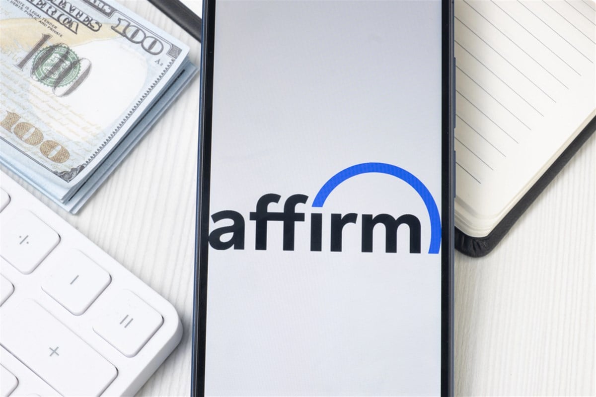 Affirm logo in front of money and computer keyboard