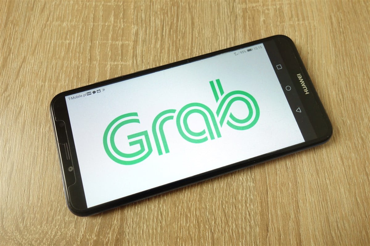 Grab Holdings Inc company logo on mobile phone