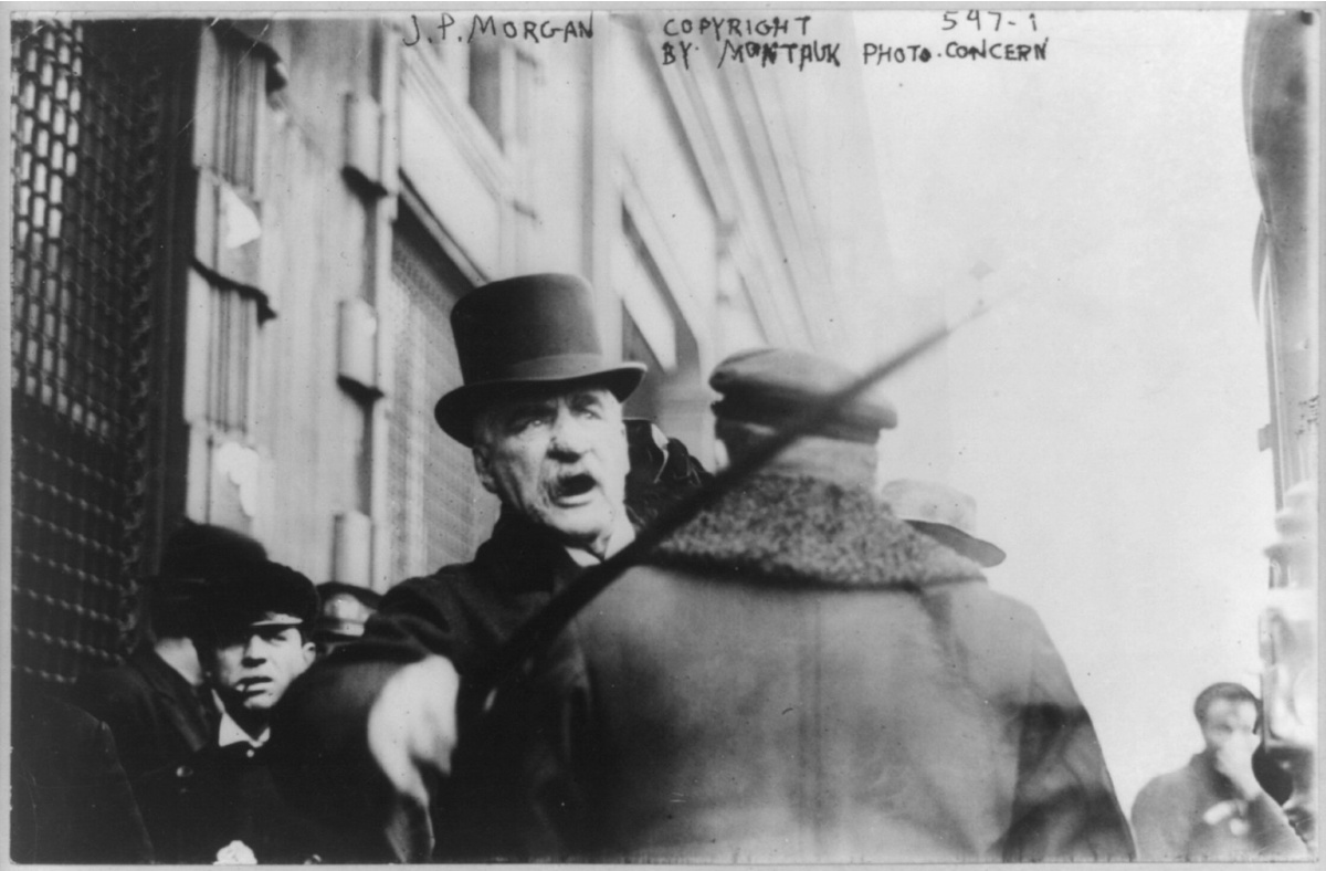 J.P. Morgan striking photographer with cane