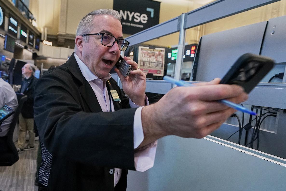 Options trader Joseph D'Arrigo works on the floor of the New York Stock Exchange, Tuesday, June 16, 2026. (AP Photo/Richard Drew)