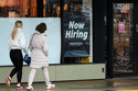 Now hiring sign is displayed at a retail store, in Arlington Heights, Ill., Thursday, April 2, 2026. (AP Photo/Nam Y. Huh)