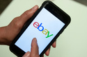 FILE - An Ebay app logo is shown on a mobile phone, July 11, 2019, in Miami. (AP Photo/Wilfredo Lee, File)