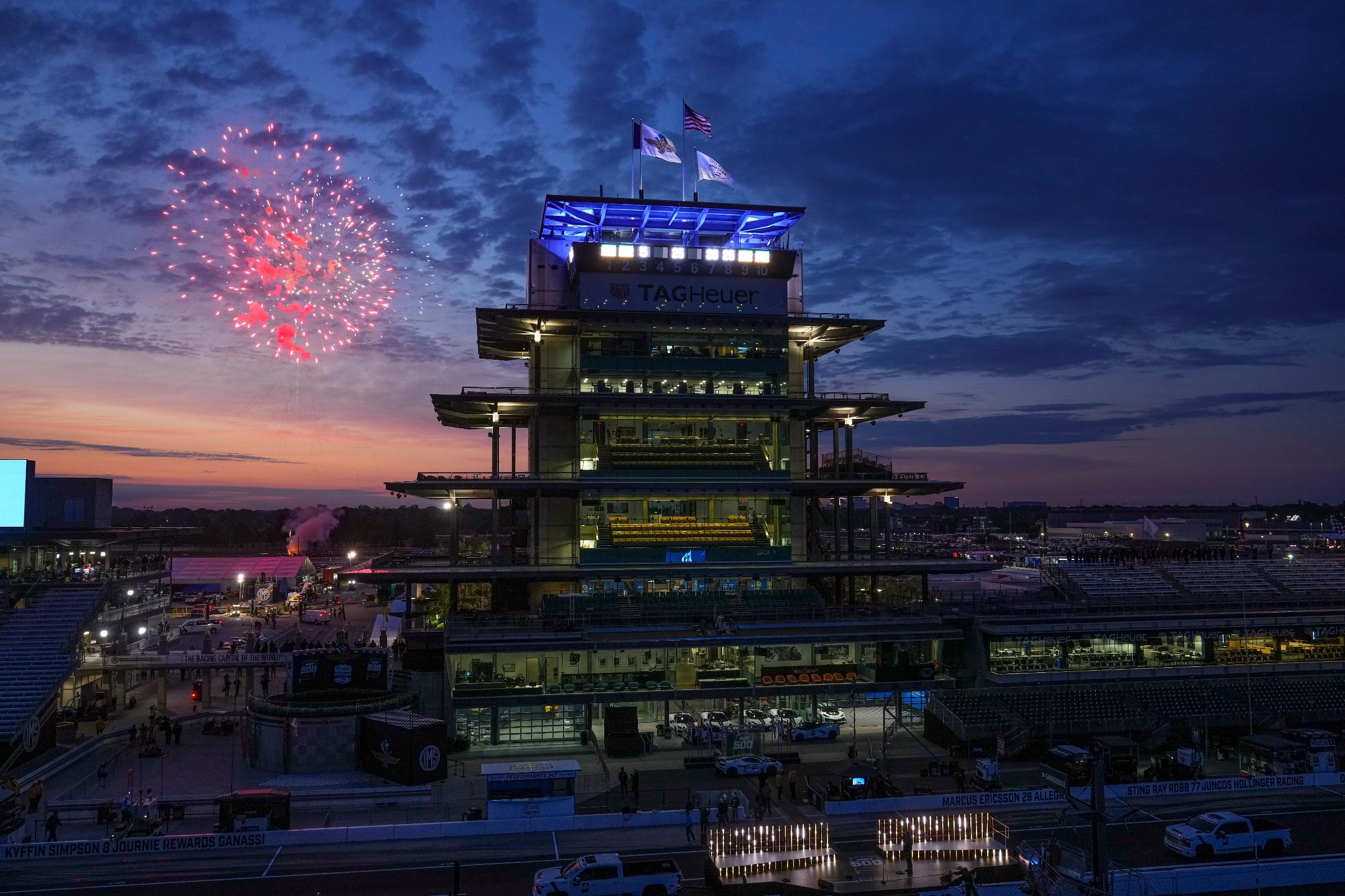 FILE - Fireworks are set off behind the Pagoda as the public gates open ahead of the Indianapolis 500 IndyCar auto race at the Indianapolis Motor Speedway in Indianapolis, May 25, 2025. (AP Photo/Michael Conroy, file)