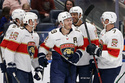 Florida Panthers left wing Matthew Tkachuk (19) is congratulated by teammates after scoring his second goal in the first period an NHL hockey game against the New York Islanders, Saturday, March 28, 2026, in Elmont, N.Y. (AP Photo/Adam Hunger)