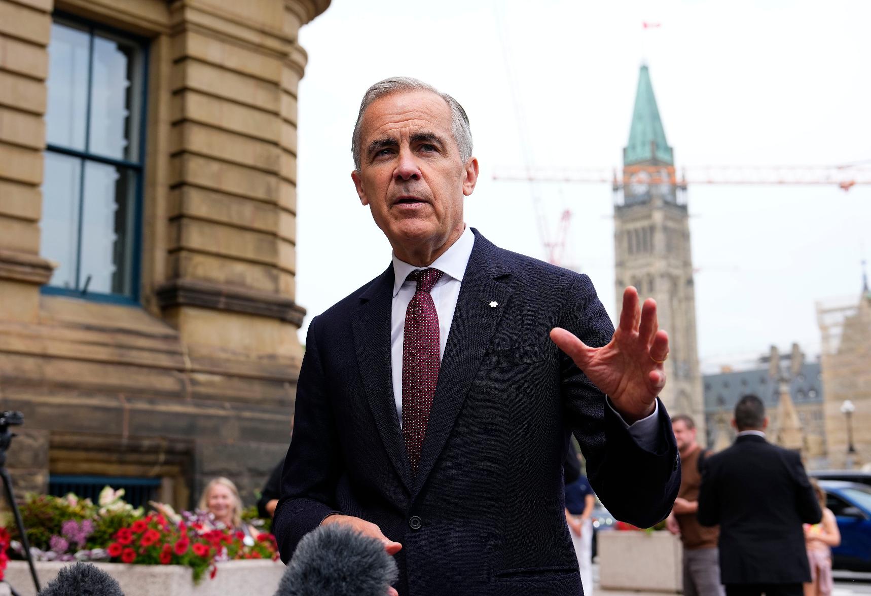 Canada Prime Minister Mark Carney makes a statement outside the Office of the Prime Minister and Privy Council in Ottawa, on Tuesday, July 21, 2026. (Justin Tang/The Canadian Press via AP)