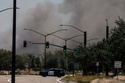 Smoke is seen from the massive fire at the Medline medical supply warehouse a million-foot facility, in Tracy, Calif., Friday, June 12, 2026. (Stephen Lam/San Francisco Chronicle via AP)