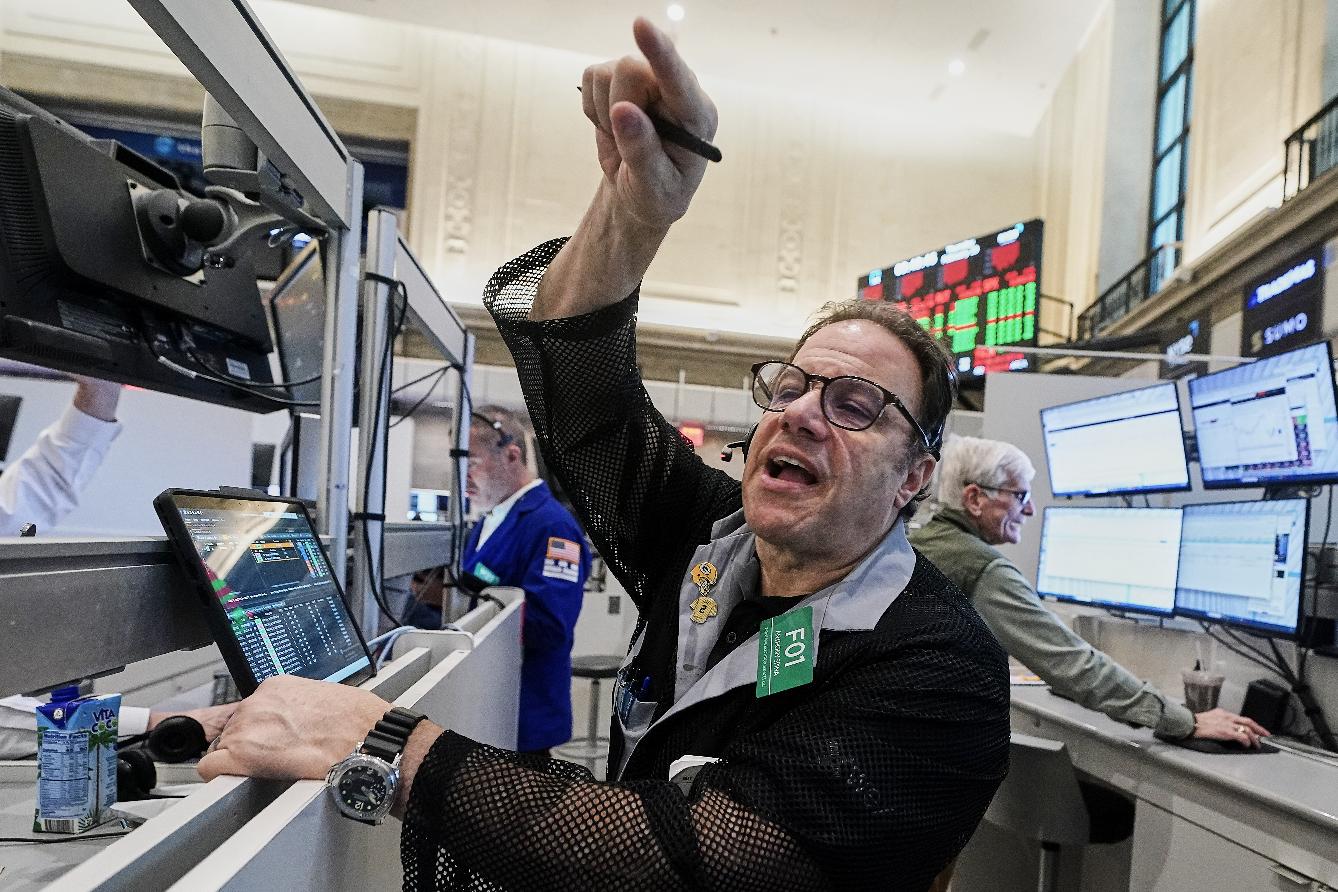 Options trader Anthony Spina works on the floor of the New York Stock Exchange, Thursday, Feb. 19, 2026. (AP Photo/Richard Drew)