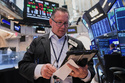 Trader Edward Curran works on the floor of the New York Stock Exchange, Tuesday, June 16, 2026. (AP Photo/Richard Drew)