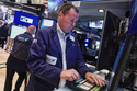 Trader Matthew Cheslock, right, works on the floor of the New York Stock Exchange, Tuesday, June 16, 2026. (AP Photo/Richard Drew)