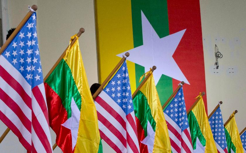 FILE - U.S. and Myanmar national flags are decorated at University of Yangon's convocation hall in Yangon, Myanmar, Nov. 19, 2012. (AP Photo/Gemunu Amarasinghe, File)