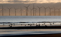FILE - An offshore wind farm is visible from the beach in Hartlepool, England, Tuesday, Nov. 12, 2019. (AP Photo/Frank Augstein, File)