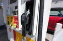 The handle stands at the ready on a pump with the three grades of gasoline available at a pump at Shell station Wednesday, June 10, 2026, in Englewood, Colo. (AP Photo/David Zalubowski)