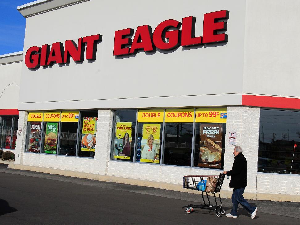 FILE - A man walks out of the Giant Eagle grocery store Thursday, Nov. 17, 2011, in Mayfield Heights, Ohio. (AP Photo/Tony Dejak, File)