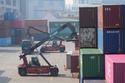 A crane unloads a container from a truck at the Uiwang ICD Terminal in Uiwang, South Korea, Thursday, March 12, 2026. (AP Photo/Ahn Young-joon)