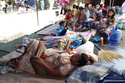 Residents take shelter in a field at a municipal hall in Sarangani province, Philippines, Wednesday, June 10, 2026. (AP Photo/Basilio Sepe)