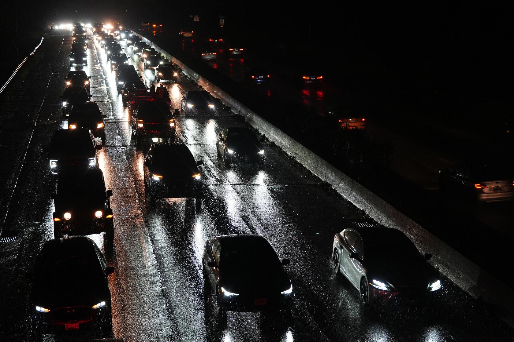 Cars drive on the Baltimore/Washington Parkway as seen from an overpass in Halethorpe, Md., Tuesday, Nov. 25, 2025. (AP Photo/Stephanie Scarbrough)