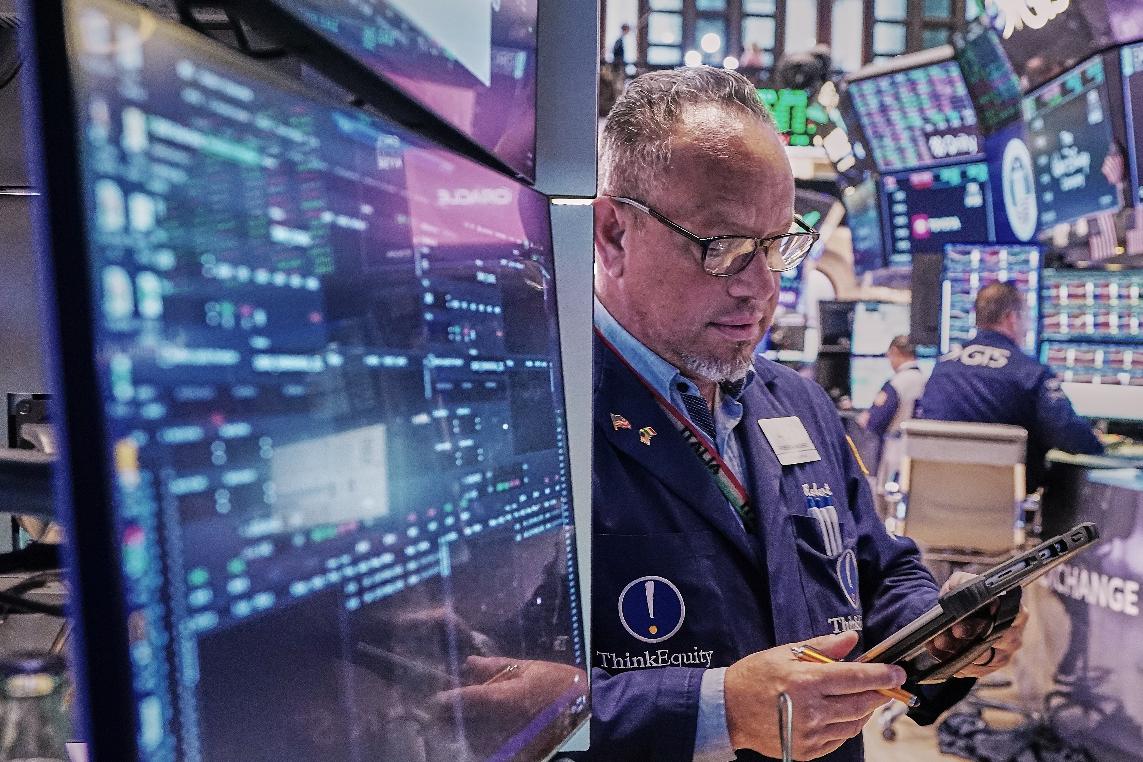 Trader Robert Arciero works on the floor of the New York Stock Exchange, Friday, May 22, 2026. (AP Photo/Richard Drew)