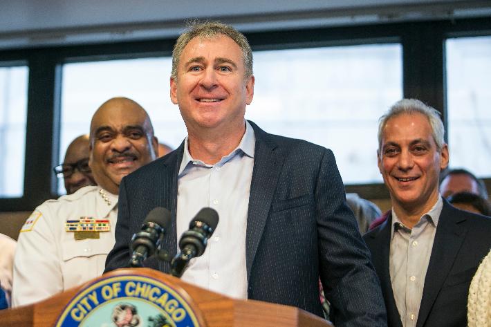 FILE - Chicago Police Supt. Eddie Johnson, left, and Mayor Rahm Emanuel, right, look on as Chicago billionaire Ken Griffin discusses a $10 million donation to reduce gun violence in the city during a press conference in Chicago, April 12, 2018. (Ashlee Rezin/Chicago Sun-Times via AP, File), File)