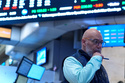 Traders work on the floor at the New York Stock Exchange in New York, Tuesday, March 10, 2026. (AP Photo/Seth Wenig)