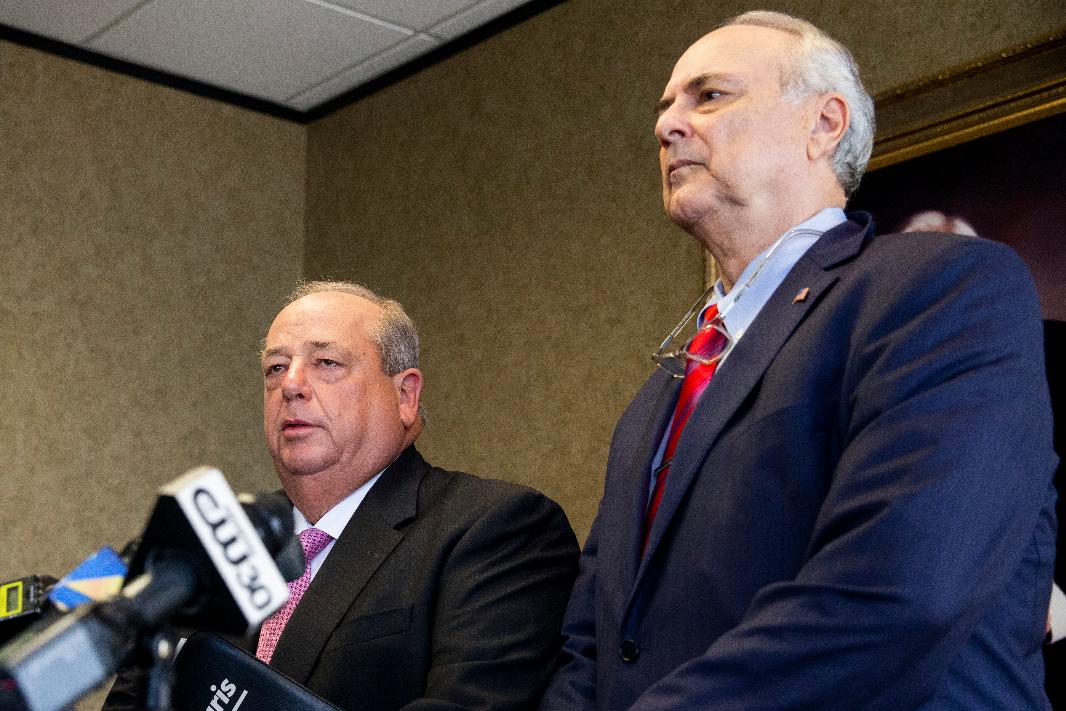 Randy Fishman, left, and Steve Farese Sr., two members of the legal team representing the Tuohy family, listen to a question from the media during a press conference in Memphis, Tenn., on Wednesday, August 16, 2023. Fishman, a lawyer for the prominent Memphis couple with a longstanding relationship to former NFL football player Michael Oher, says that they want to end a conservatorship that he’s challenging in court. (Chris Day/The Commercial Appeal via AP)