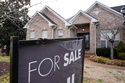 A "for sale" sign is posted outside a home in Nashville, Tenn., on Tuesday, Feb. 10, 2026. (AP Photo/George Walker IV)