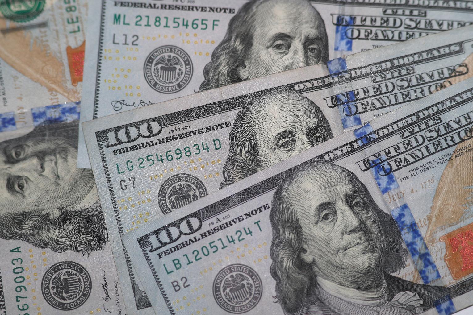 FILE - Hundred dollar bills are seen in Dallas on Jan. 22, 2020. (AP Photo/LM Otero, File)